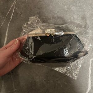 New Black and Gold Mini Bag/ Clutch like bag. With giant rhinestone clasp